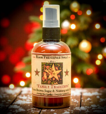 Family Traditions Room Spray, formerly Christmas Traditions, 4 oz amber bottle with folk-art holiday label. Brown sugar, nutmeg, and pine fragrance.