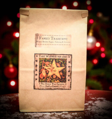 Family Traditions Bag of Tarts, formerly Christmas Traditions, kraft bag with folk-art holiday label. Includes 12 wax tart squares scented with brown sugar, nutmeg & pine.