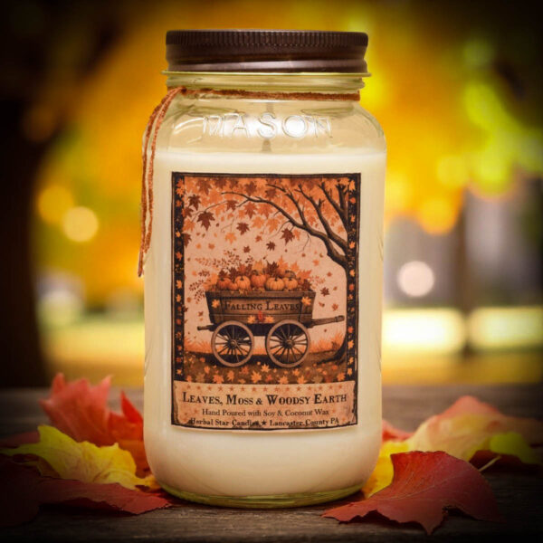 Falling Leaves 24 oz jar candle with folk art label of pumpkin wagon and falling autumn leaves