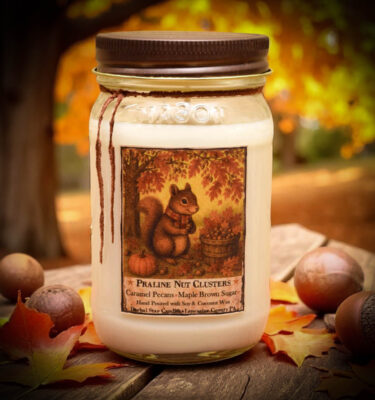 16 oz mason jar candle labeled Praline Nut Cluster with antique pewter lid in a warm dessert scent of roasted pecans and caramel