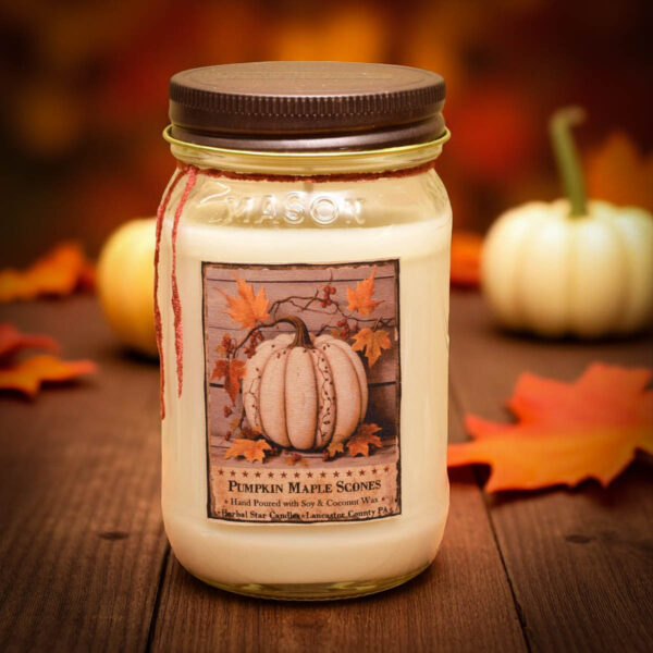 16 oz Pumpkin Maple Scones jar candle with rustic fall label featuring pumpkins, scones, and warm autumn accents.