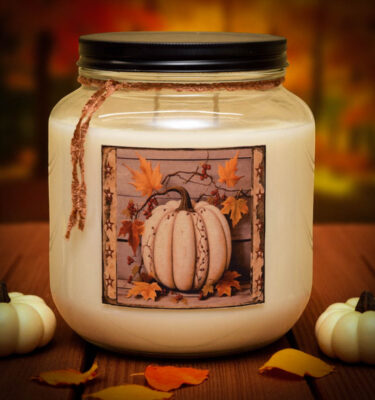 64 oz Pumpkin Maple Scones double-wick candle in mason jar with rustic label and antique pewter lid, surrounded by cozy autumn accents.