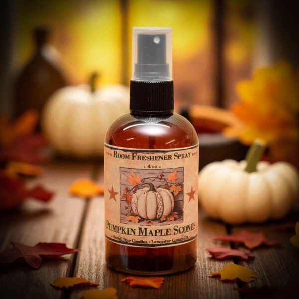 Pumpkin Maple Scones room spray in amber bottle with rustic label, set among fall decor and pumpkin treats.
