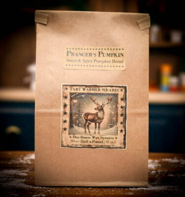 Bag of 12 Prancer’s Pumpkin Bread soy wax tart squares in festive holiday packaging.