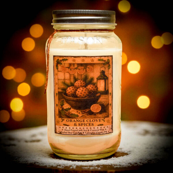 “24 oz Orange Clove Candle in Old Look Mason Jar with vintage tin lid, folk-art label, hand-poured by Herbal Star Candles in Lancaster County, PA”