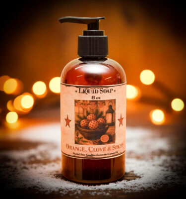 “Orange Clove Liquid Soap in 8 oz amber pump bottle with folk-art label, hand-poured by Herbal Star Candles in Lancaster County, PA”