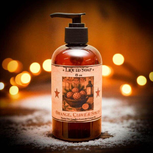 “Orange Clove Liquid Soap in 8 oz amber pump bottle with folk-art label, hand-poured by Herbal Star Candles in Lancaster County, PA”