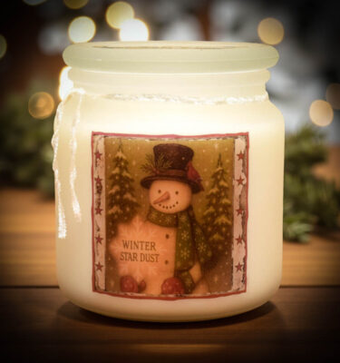 Winter Star Dust Frosted Apothecary Jar candle with snowman folk-art label—rich vanilla and spicy cinnamon scent, hand poured in Lancaster County, PA.