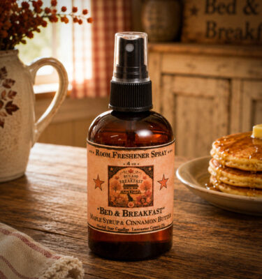 Bed and Breakfast Room Spray with maple syrup and cinnamon butter fragrance displayed on a rustic farmhouse breakfast table.