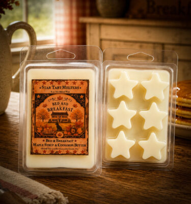 Bed and Breakfast Star Tart Melter wax melts displayed on a rustic farmhouse table with pancakes and vintage kitchen decor.
