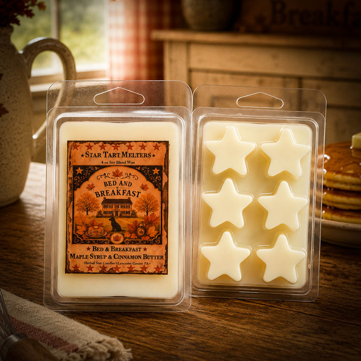 Bed and Breakfast Star Tart Melter wax melts displayed on a rustic farmhouse table with pancakes and vintage kitchen decor.