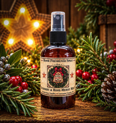 Herbal Star Candles Bayberry & Rose-Merry Mint 4 oz room freshener spray with a festive Christmas wreath label, displayed with bayberry and rosemary greenery.